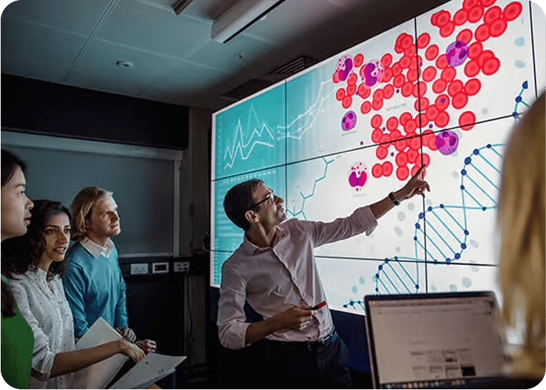 Instructor discussing cells and dna on an interactive screen to curious students 