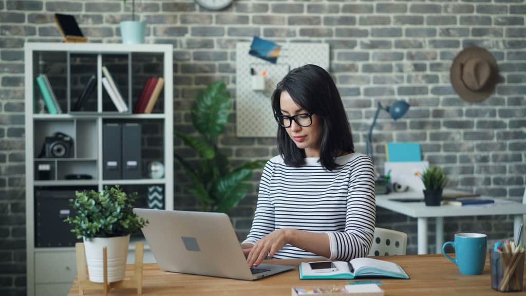 striped woman with laptop