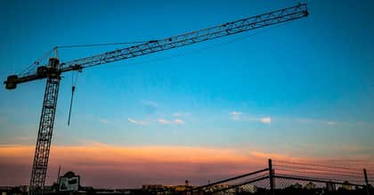 Crane Working In Sunset Sky 1200 x 627
